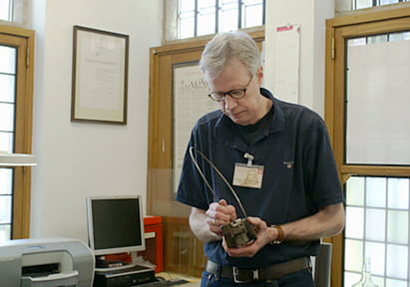 Frank E. Blokland with mould at Museum Plantin-Moretus